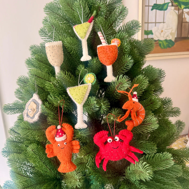 Colorful Christmas Food & Drinks ornaments hanging on a festive Christmas tree.