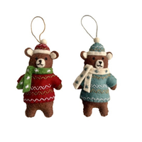 Bears in Christmas sweaters decorations in red and blue, hand-stitched from wool, showcasing festive scarves and snowflake designs.