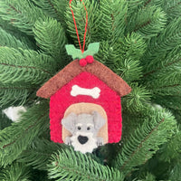 Christmas Schnauzer in Kennel ornament hanging on a Christmas tree with greenery.