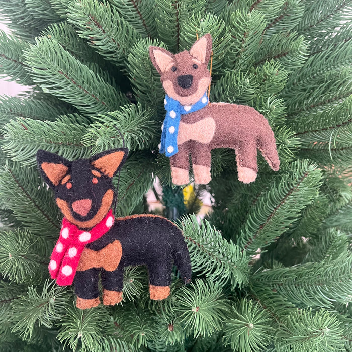 Kelpie dog Christmas decoration featuring two felt ornaments with scarves on a Christmas tree.