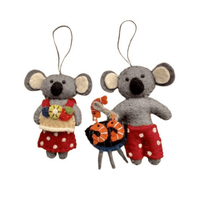 Koala with Aussie Christmas treats decorations, featuring a koala holding pavlova and another at a barbecue with prawns.