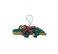 Crocodile Christmas Decoration featuring a green crocodile with a festive scarf for holiday cheer.