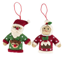 Mr and Mrs Claus in Christmas sweaters, handmade felt ornaments ready for festive decoration.