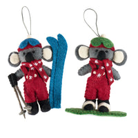 Christmas snowboarding & skiing Koalas in cute winter outfits with skis, ready for alpine fun.