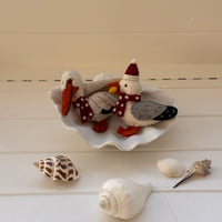 Handmade Christmas Pelican Decoration featuring felt pelicans on a seashell, perfect for beach-themed holiday decor.