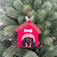 Christmas Dachshund in Kennel decoration on a Christmas tree branch.