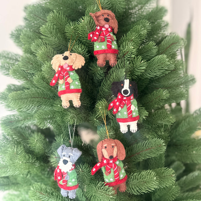 Christmas dogs in coats and candy cane decorations featuring five breeds in festive attire hanging on a Christmas tree.