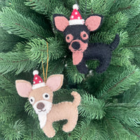 Chihuahua Christmas decoration featuring two felt ornaments in festive Santa hats hanging on a Christmas tree.