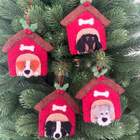 Decorative Christmas ornaments featuring various dog breeds in red kennels, perfect for festive holiday decor.