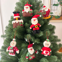 Santa in Sleigh Christmas Decoration featuring felt ornaments on a festive Christmas tree.