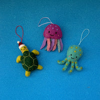 Sea creature Christmas decorations featuring a turtle, jellyfish, and octopus with sparkly beads.