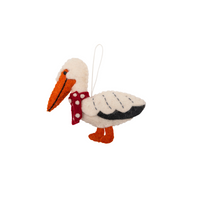 Handmade felt Christmas Pelican Decoration featuring a red scarf with polka dots.